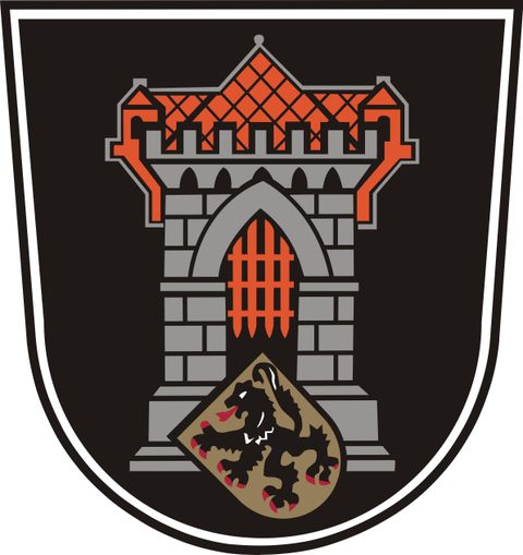 Ein Wappen mit einem grauen Turm und einem roten Dach. Darunter befindet sich ein Schild mit einem Löwen.